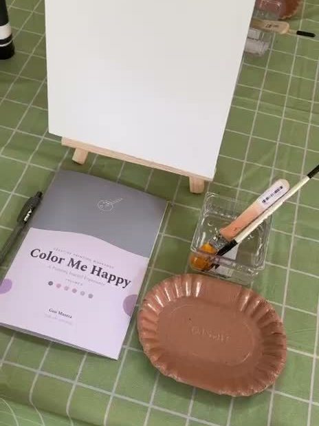 Color Me Happy journal and blank canvas on the table
